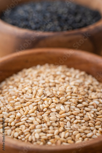 wihite sesame in wooden plate