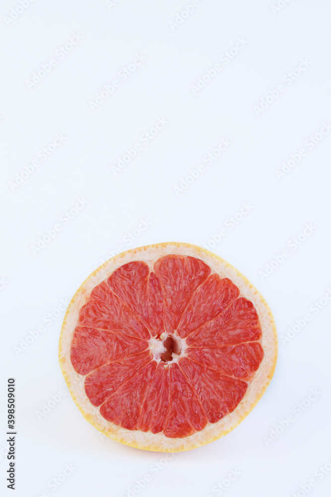 Half grapefruit against white background with copy space Half grapefruit against white background with copy space