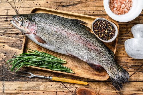 Raw fresh trout fish. wooden background. Top view