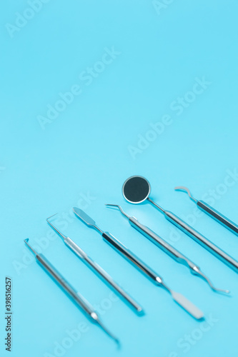 Dental set instruments on dentistry background