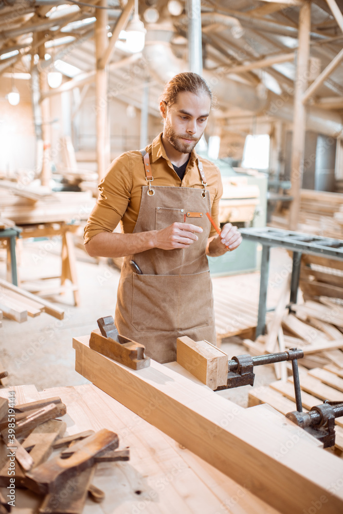 Portrait of a thoughtful carpenter indoors Portrait of a thoughtful carpenter indoors