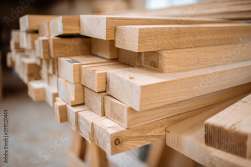 Fotografija Pile of pine planks at the warehouse