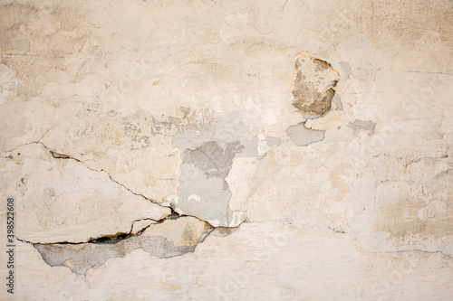 Texture of the old wall with peeling paint, plaster with cracks. Texture backround.