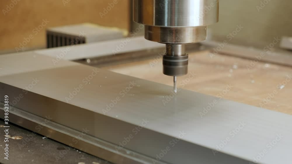 Drilling CNC machine tool makes part. Close-up. Drilling CNC machine tool makes part. Close-up.