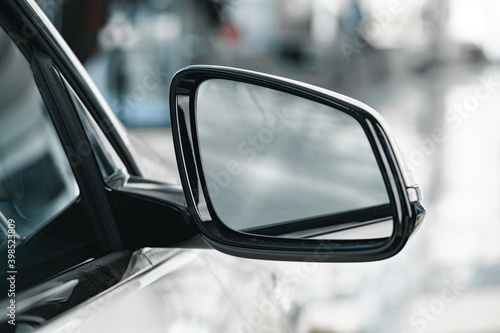 Mirror of a new white luxury car