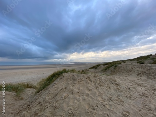 Camber sands beach  Rye  East Sussex UK  Camber is a flat sandy beach with giant sand dunes on South coast England and popular with tourists and daytrippers in Summer 