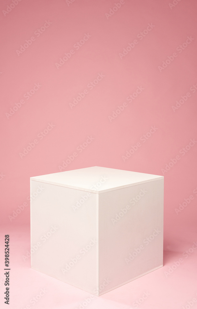 White cube on the pink background. White platform for objects. White cube on the pink background. White platform for objects.