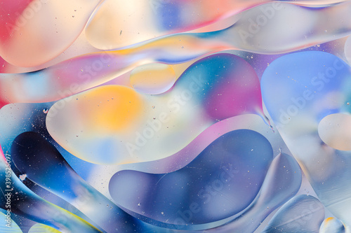 Wallpaper Mural Close-up of the movement of oil droplets on the water surface. Colorful abstract macro background of oil drops on the water surface. Torontodigital.ca