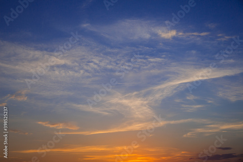 Blue orange sunset with clouds. © Arina B