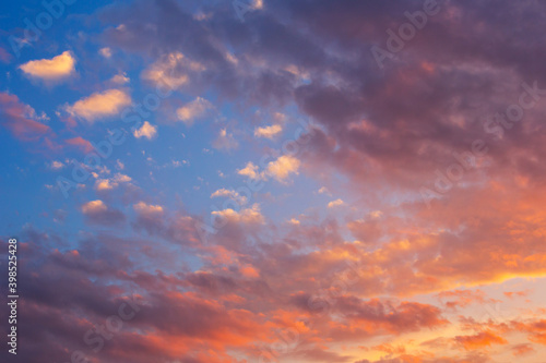 Blue orange sunset with clouds. © Arina B