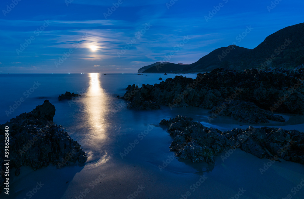 The Moon in Trengandin beach, Noja, Marismas de Santoña, Noja y Joyel Natural Park, Cantabrian Sea, Cantabria, Spain, Europe