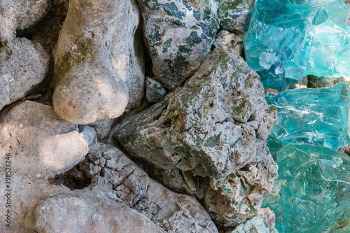 Rock stones and blue crystals, background, texture. Concept, top view