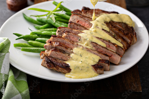 Steak with bearnaise sauce made with tarragon photo