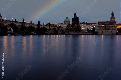 .rainbow after the rain on the old stone Charles bridge on the river Vltava in the center of Prague in the early evening
