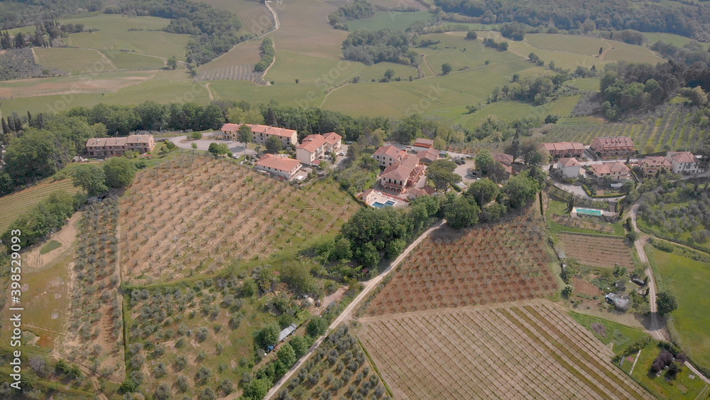Top 4K aerial shooting of a small countryside and big fantastic vineyards.