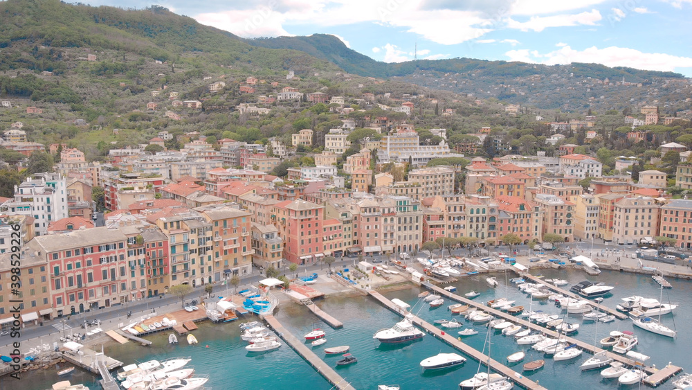 aerial view of municipality Santa Margherita Ligure in summer day, white yachts are moored in small bay