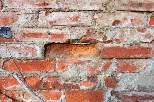 Red brick wall, dropped one brick © Ольга Бошарова
