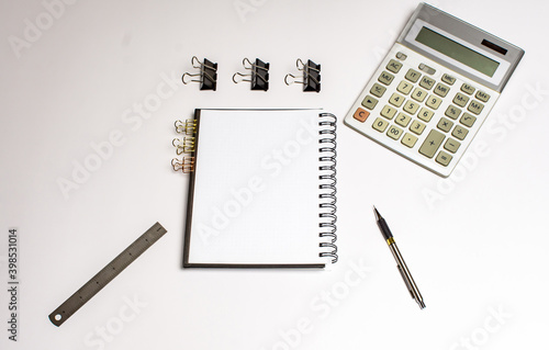 Notepad calculator lying on a white background with space to write a calculator