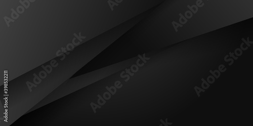 Abstract dark background of small triangle or pixels in shades of black and gray colors.