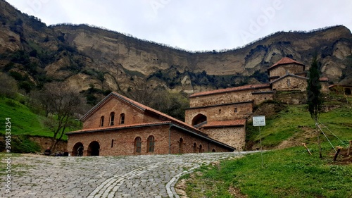An ancient monastery in the vicinity of the city of Tbilisi on a cloudy day.
