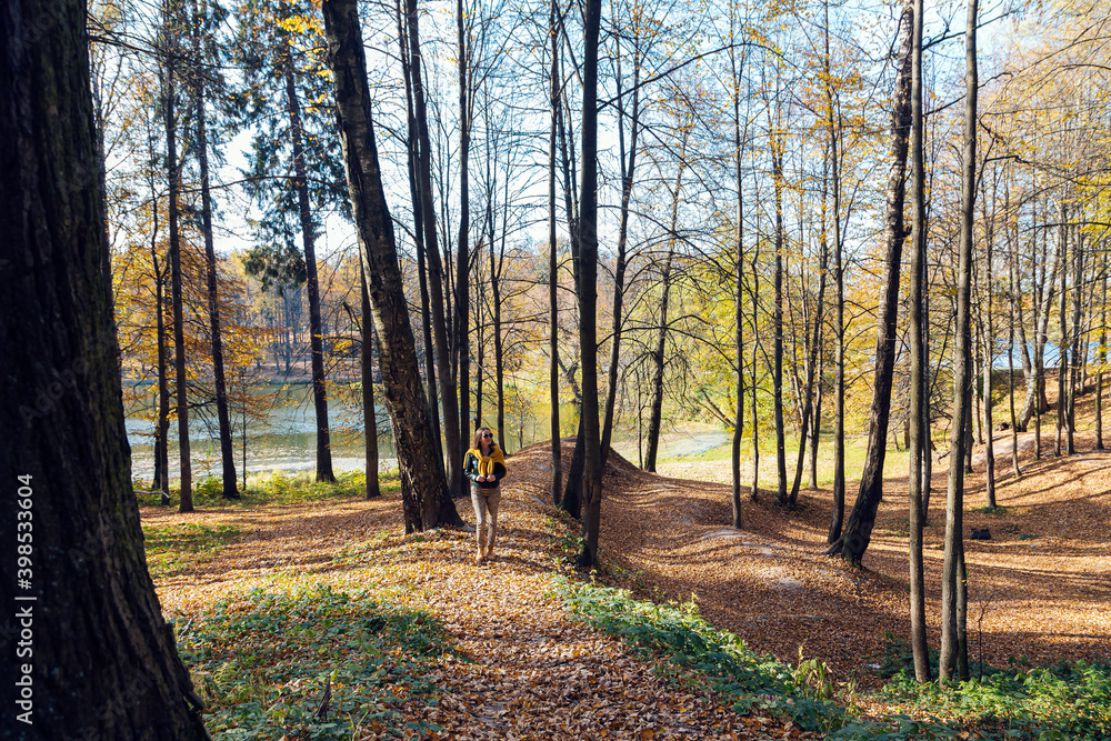 Mid adult woman exploring public park on sunny day