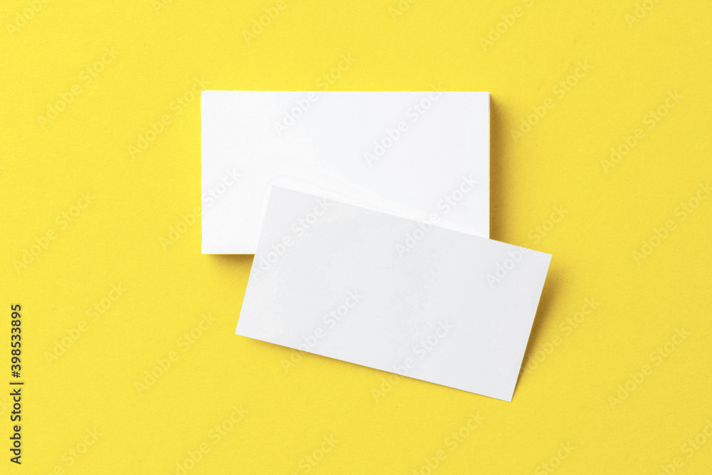 Blank paper business mock up on Illuminating Yellow background Blank paper business mock up on Illuminating Yellow background