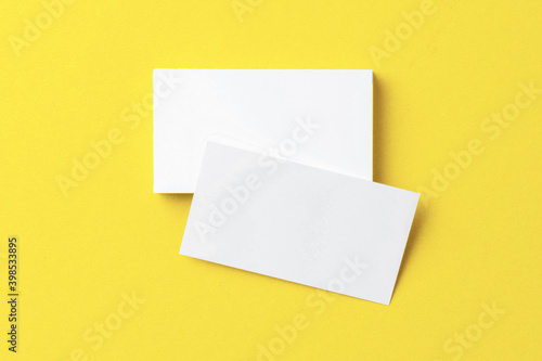 Blank paper business mock up on Illuminating Yellow background
