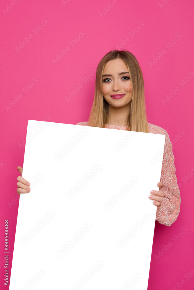 Smiling Young Woman Is Holding White Big Placard Smiling Young Woman Is Holding White Big Placard