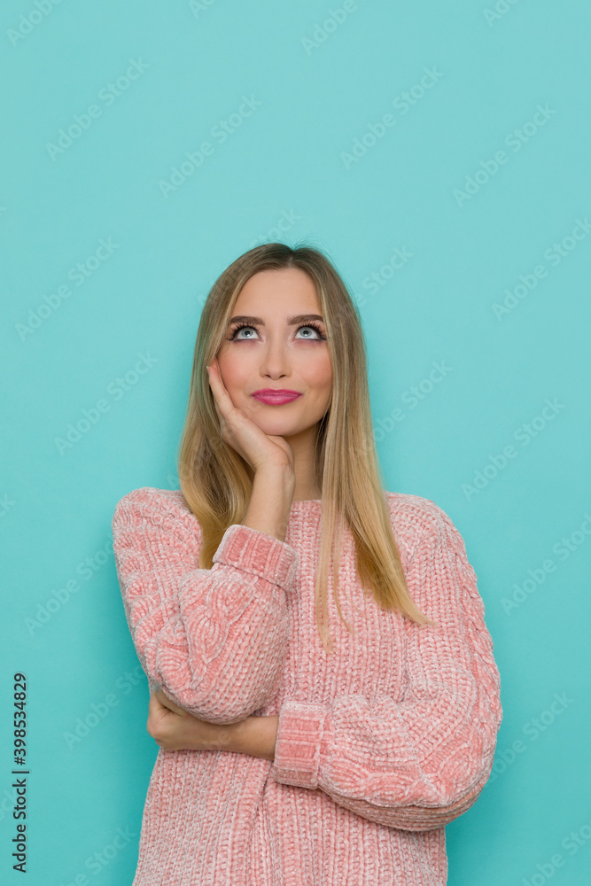 Cheerful Young Woman Is Holding Hand On Chin And Looking Up Cheerful Young Woman Is Holding Hand On Chin And Looking Up
