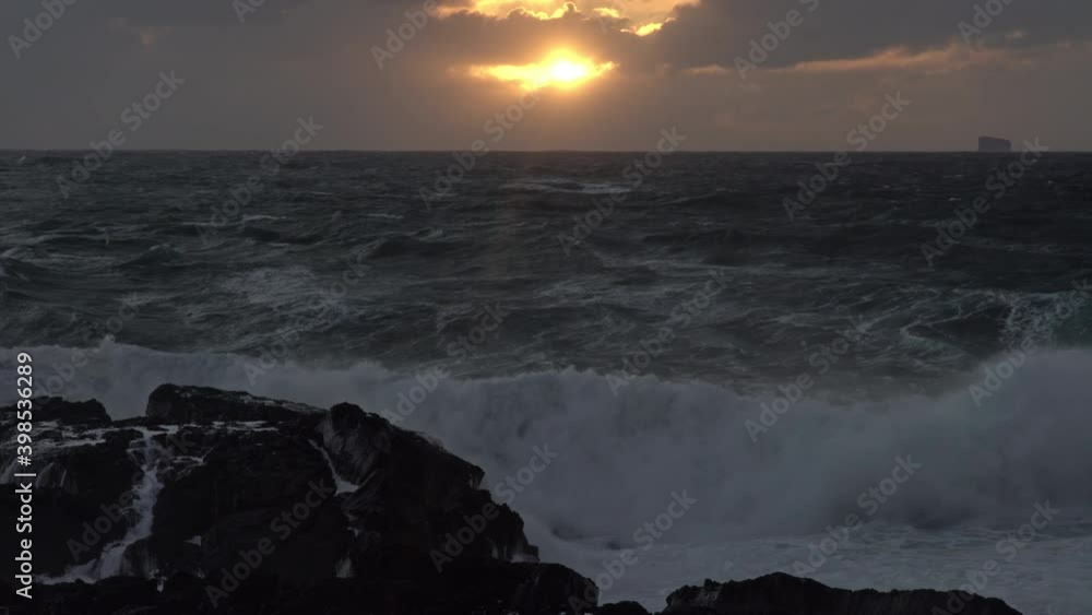 Ocean storm waves crashing in front of sunset rays Reykjanes Iceland Ocean storm waves crashing in front of sunset rays Reykjanes Iceland