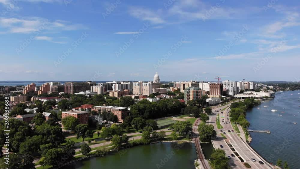 Drone Aerial View of Madison, Wisconsin USA. Cityscape, Downtown in Skyline and Traffic on Freeway by Monona Lake on Sunny Summer Day Drone Aerial View of Madison, Wisconsin USA. Cityscape, Downtown in Skyline and Traffic on Freeway by Monona Lake on Sunny Summer Day