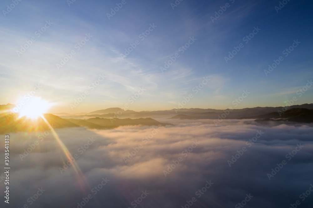 Flying through the clouds at dawn above the jumping lake in Rieti