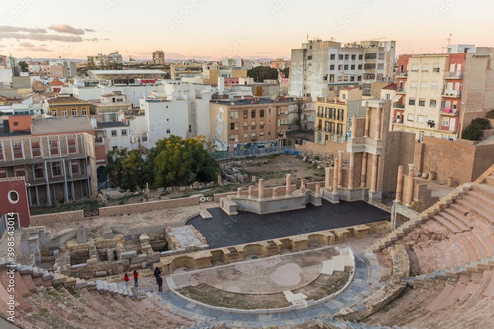 CARTAGENA, SPAIN - December 2, 2017: Aerial panoramic view of famous roman amphitheater. Beautiful sunset over the mountains. Wide angle lens panorama