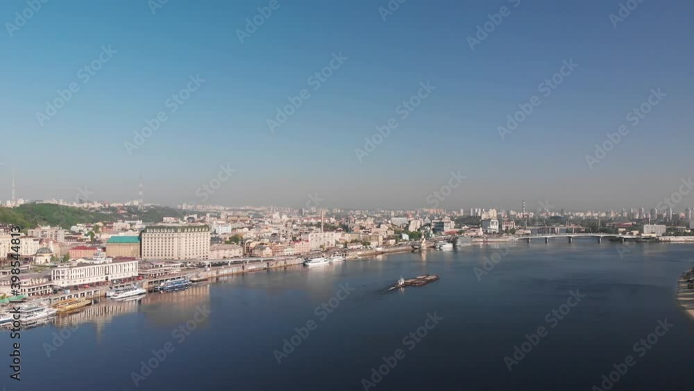Tugboat on the river. Tugboat pushing the barge aerial footage. Camera flies around the barge and the tugboat Tugboat on the river. Tugboat pushing the barge aerial footage. Camera flies around the barge and the tugboat