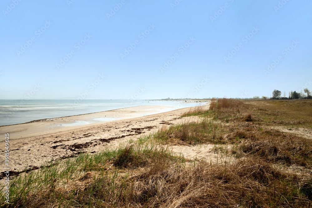 Beach on the east coast of the Swedish island of Oeland. Long exposure, with the ocean in the background Beach on the east coast of the Swedish island of Oeland. Long exposure, with the ocean in the background