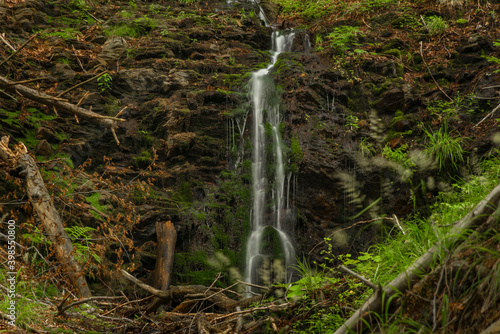 Waterfall near Kouty nad Desnou village in summer day