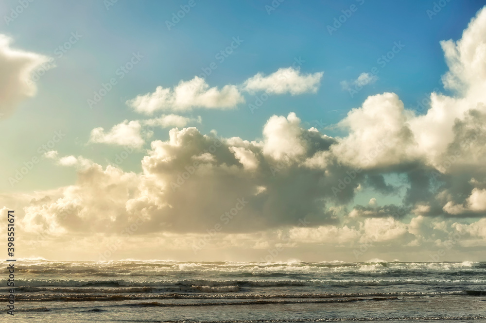 Big fluffy clouds above seashore