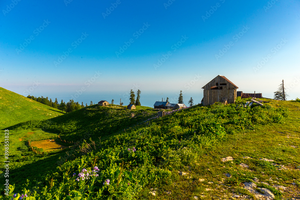 Scenery mountain landscape at Caucasus mountains with old hut Scenery mountain landscape at Caucasus mountains with old hut