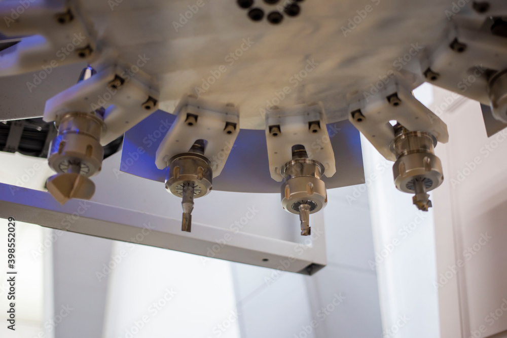 a set of cutters on a cnc machine on mdf panels closeup, the