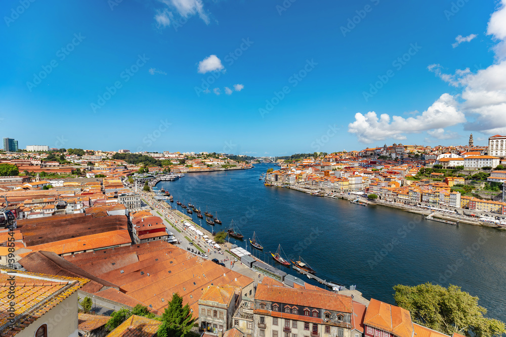Picturesque cityscape image of Porto (Oporto), Portugal with the famous Luis I Bridge and the Douro River.