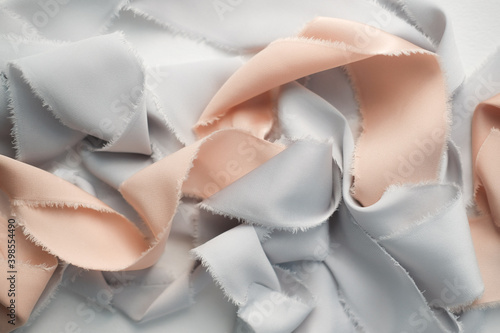 Wallpaper Mural grey and peach silk ribbons on a light background . sewing theme . the view from the top . space for text. Torontodigital.ca