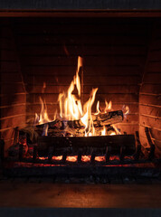 Fireplace, fire burning, cozy warm fireside, christmas home.
