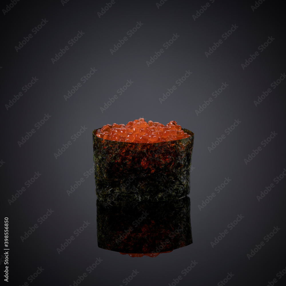 Japanese sushi on a gray-black background.
Japanese sushi on a gray-black background.
