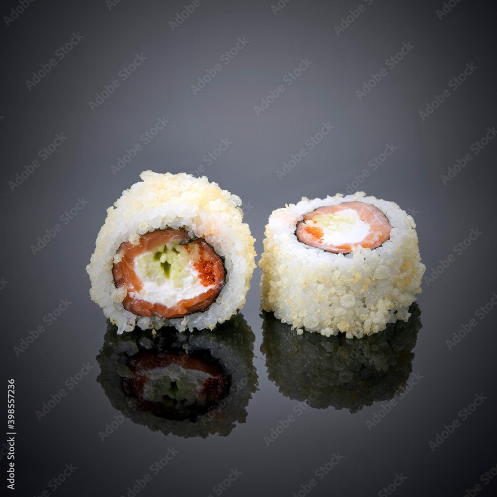 Japanese sushi on a gray-black background.
Japanese sushi on a gray-black background.