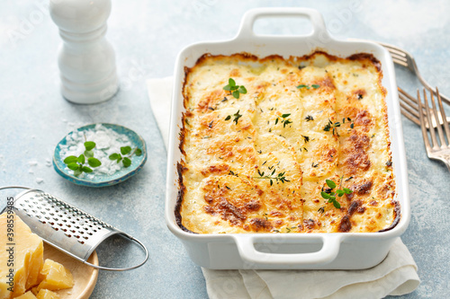Cheesy scalloped potatoes with thyme and parmesan