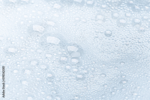 Background of soap foam and bubbles on a white background, macro photography