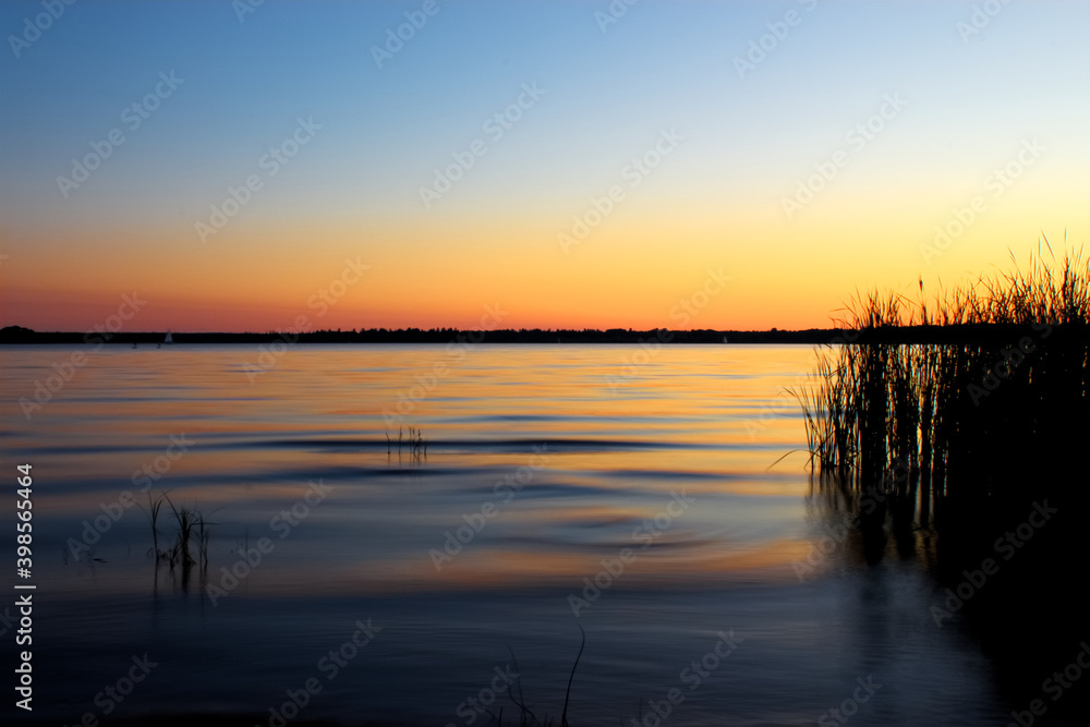 Sunset on a river, long exposure. Quebec, Canada Sunset on a river, long exposure. Quebec, Canada