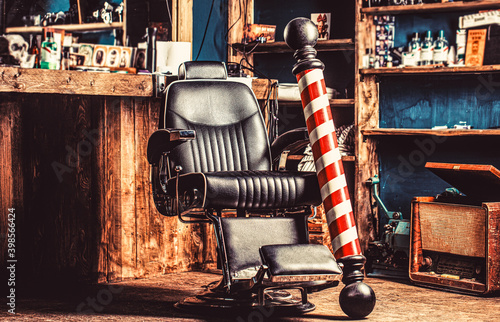 Barbershop armchair, salon, barber shop for men. Barber shop pole. Logo of the barbershop, symbol