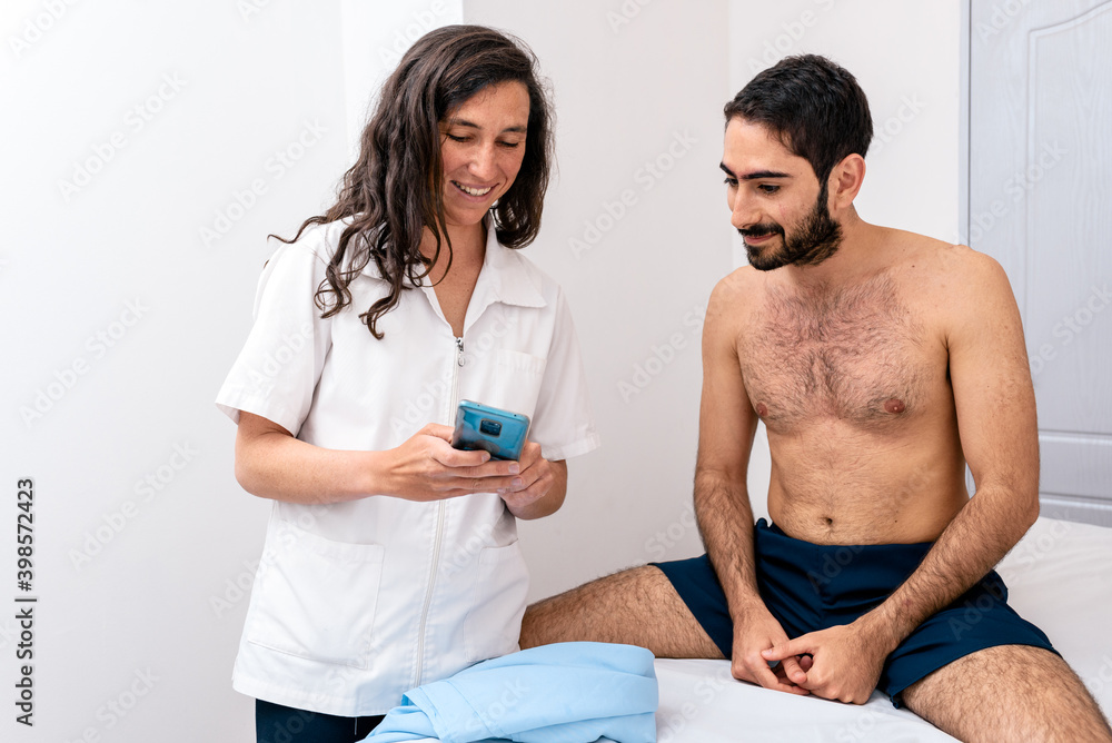 Fototapeta premium Women physiotherapist talking with a patient.