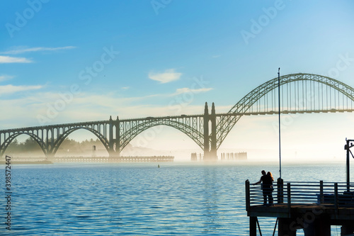 Couple looks a view of the Yaquina Bay Bridge © Dee